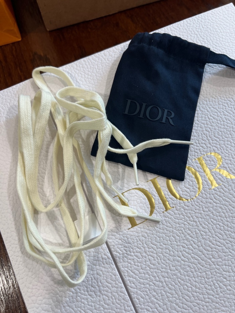 Dior Cream Flat Shoelaces with Navy Branded Pouch